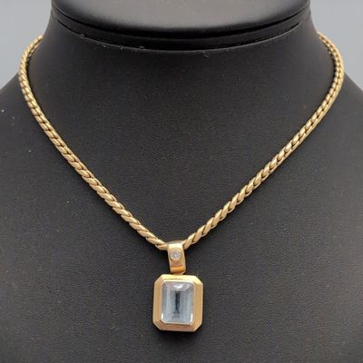 COLLIER en or jaune (750/1000e) avec pendentif en or, diamant et topaz - Photo 1