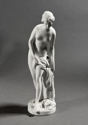 black and white photograph of a statue of a woman holding a towel