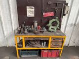 a workbench with a lot of tools on top of it