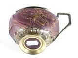 a purple vase with a gold handle and a picture on it