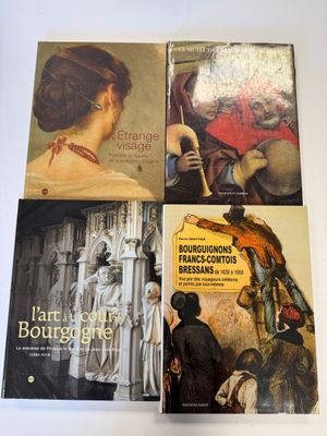 trois livres posés sur une table blanche, avec un tableau représentant une femme et un homme