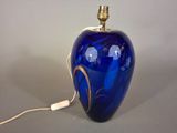 an image of a blue glass lamp on a table