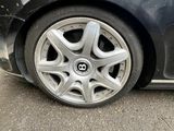 a close up of a car ' s tire on the street