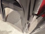 a stack of metal chairs sitting next to each other on the floor