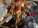 a box full of dolls sitting on a table