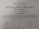 an old document with writing on it sitting on a table