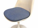 a white chair with a blue seat and a white base