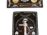 two wooden plaques with a cross and a anchor on them