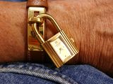 a close up of a person ' s wrist with a padlock on it