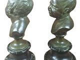 pair of bronze busts of a boy and a girl