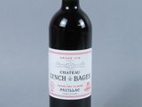 a picture of a bottle of wine with a red cap