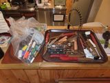 a kitchen counter with a lot of tools on it