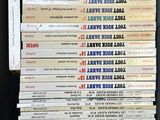 a lot of books that are stacked on top of each other