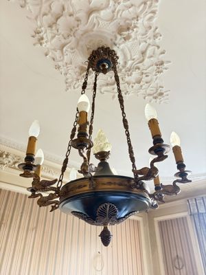 a chandelier hanging from the ceiling in a room