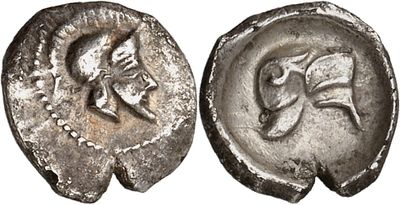 a silver coin with an image of a horse on it