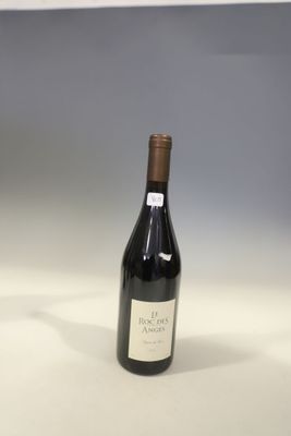 a bottle of wine that is sitting on a table