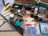a table with a lot of tools and supplies on it