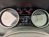 a close up of a car dashboard with gauges and speedometers