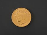 an image of a gold coin on a black surface