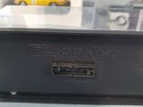 a black box with a yellow car in it