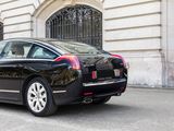 a black car that is parked in front of a building