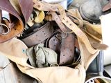 a pile of shoes and other items on a table
