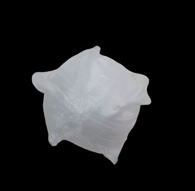 a large piece of ice that is sitting on top of a black surface