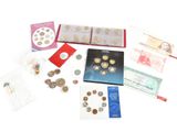 a lot of different coins and cards on the table