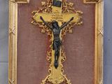 an image of a gold framed cross with a crucifix on it
