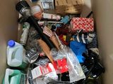 a cardboard box filled with assorted items in it