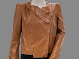 an image of a mannequin mannequin wearing a brown leather jacket