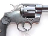 a gun that is sitting on a white surface