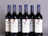 six bottles of red wine are lined up in a row
