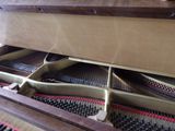 a close up of the inside of a piano