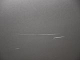 a plane that is flying in the sky through the fog