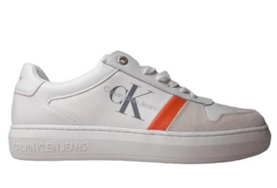 a close up of a pair of white sneakers with an orange stripe