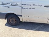 an image of a white van parked in a parking lot