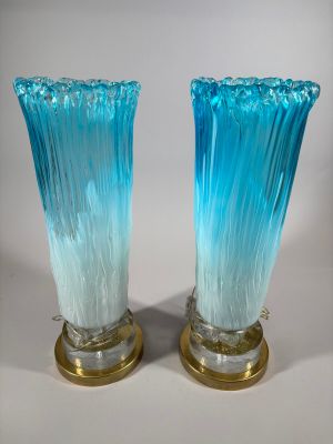 pair of blue glass vases with gold bases on a white background