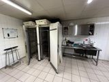 an image of a commercial kitchen with a lot of appliances