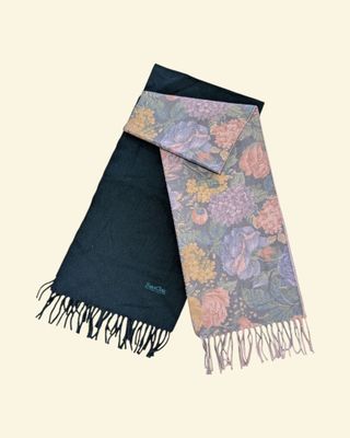 two scarfs with different designs on them on a white background