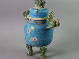 an image of a blue and green vase with a frog on it
