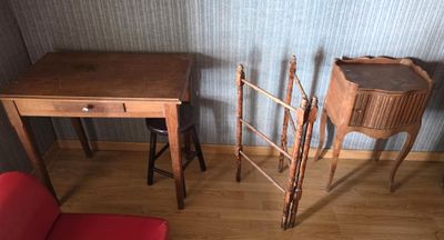 two chairs and a table in the corner of a room
