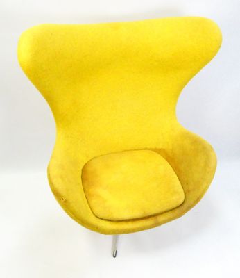 an image of a yellow chair sitting on top of a white floor