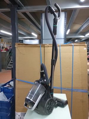 a vacuum that is sitting on a table in a room