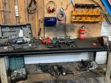 a workbench with tools on it in a garage