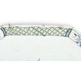 a plate with a bird on it on a white background