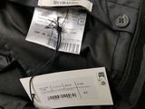 a label on the back of a black backpack