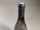 a bottle of wine that is sitting on a table