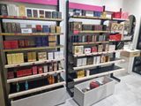 many shelves of cigarettes in a store with boxes on them