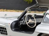 a silver sports car with its open hood open